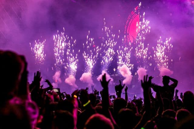 Confetti falling over a cheering crowd