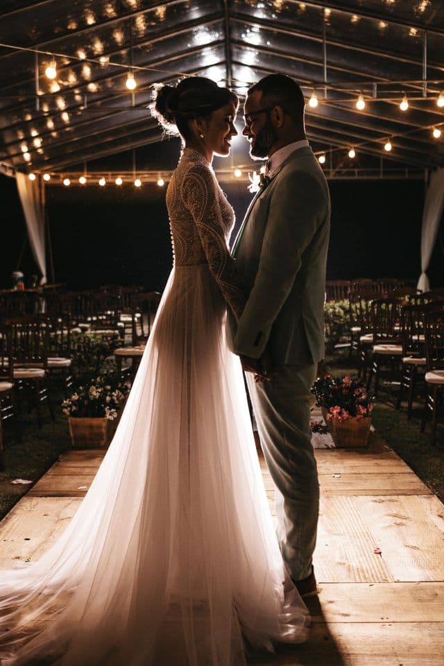 Bride beneath strings of fairy lights